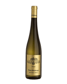 Franz Hirtzberger Grüner Veltliner Smaragd Honivogl 2021 Weißwein in einer Weinflasche auf einem Weinglas.
